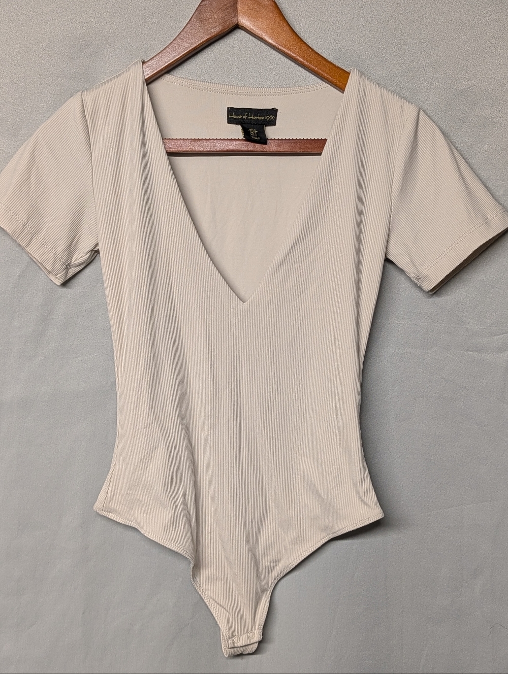 House of Harlow 1960 Ribbed V-Neck Short Sleeve Bodysuit in Light Beige